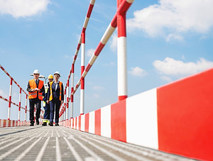 Workers Wearing Helmets and Jackets